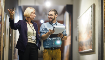 Male and female museum curator