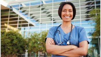 Doctor in front of hospital